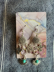 Western style handmade earrings in vintage silver
