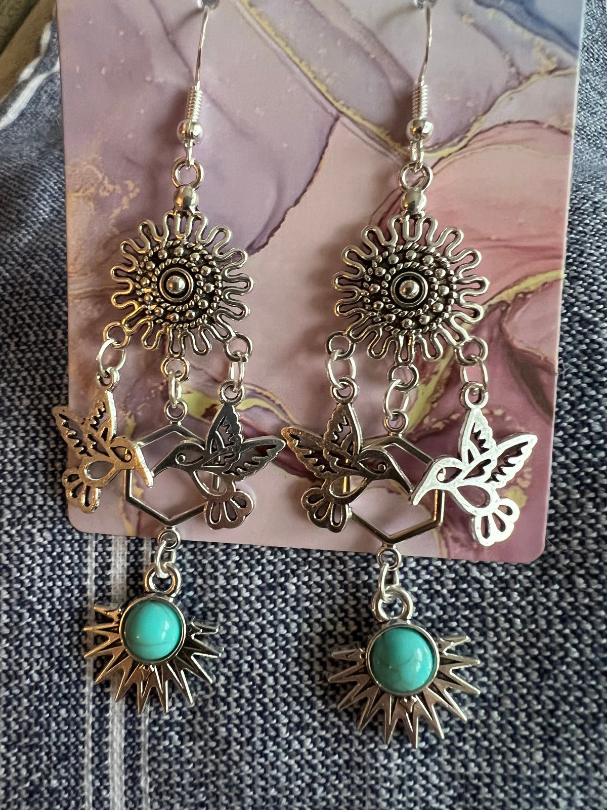 Western style handmade earrings in vintage silver